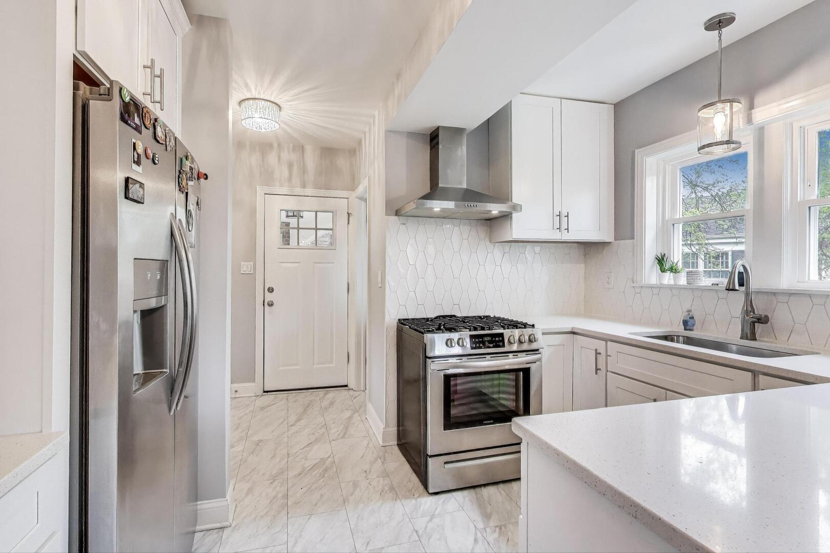 2515 Gordon Drive Flossmoor, IL 60422 - Photo 11 of 42 a kitchen with stainless steel appliances granite countertop a refrigerator sink and stove