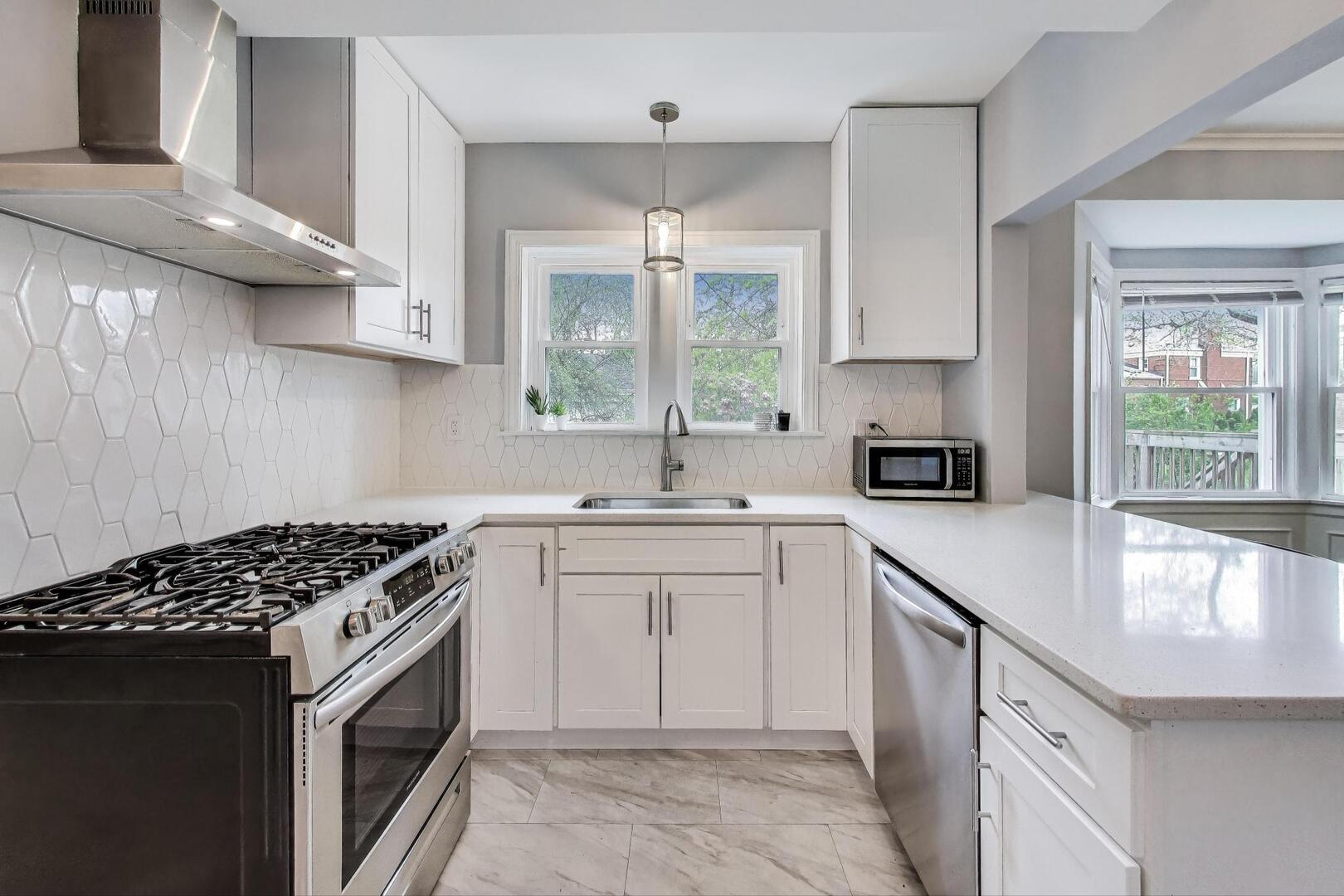 2515 Gordon Drive Flossmoor, IL 60422 - Photo 12 of 42 a kitchen with a sink stove top oven and cabinets