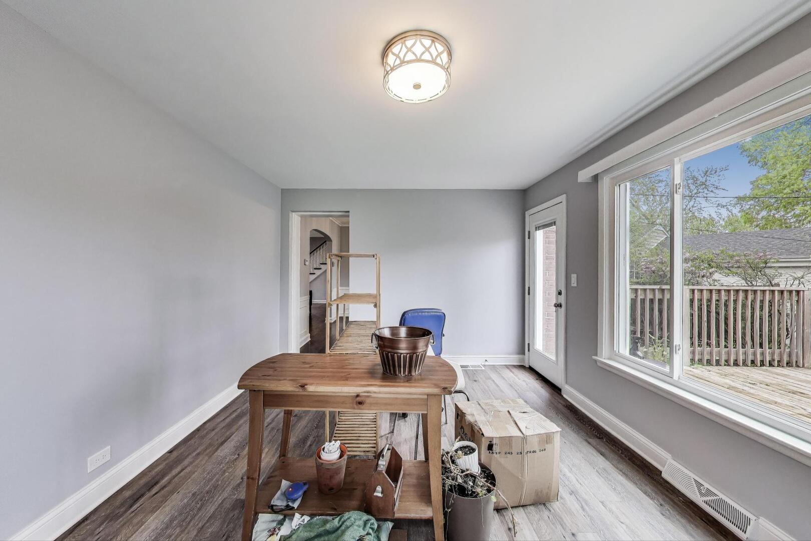 2515 Gordon Drive Flossmoor, IL 60422 - Photo 15 of 42 a view of a room with furniture large windows and wooden floor