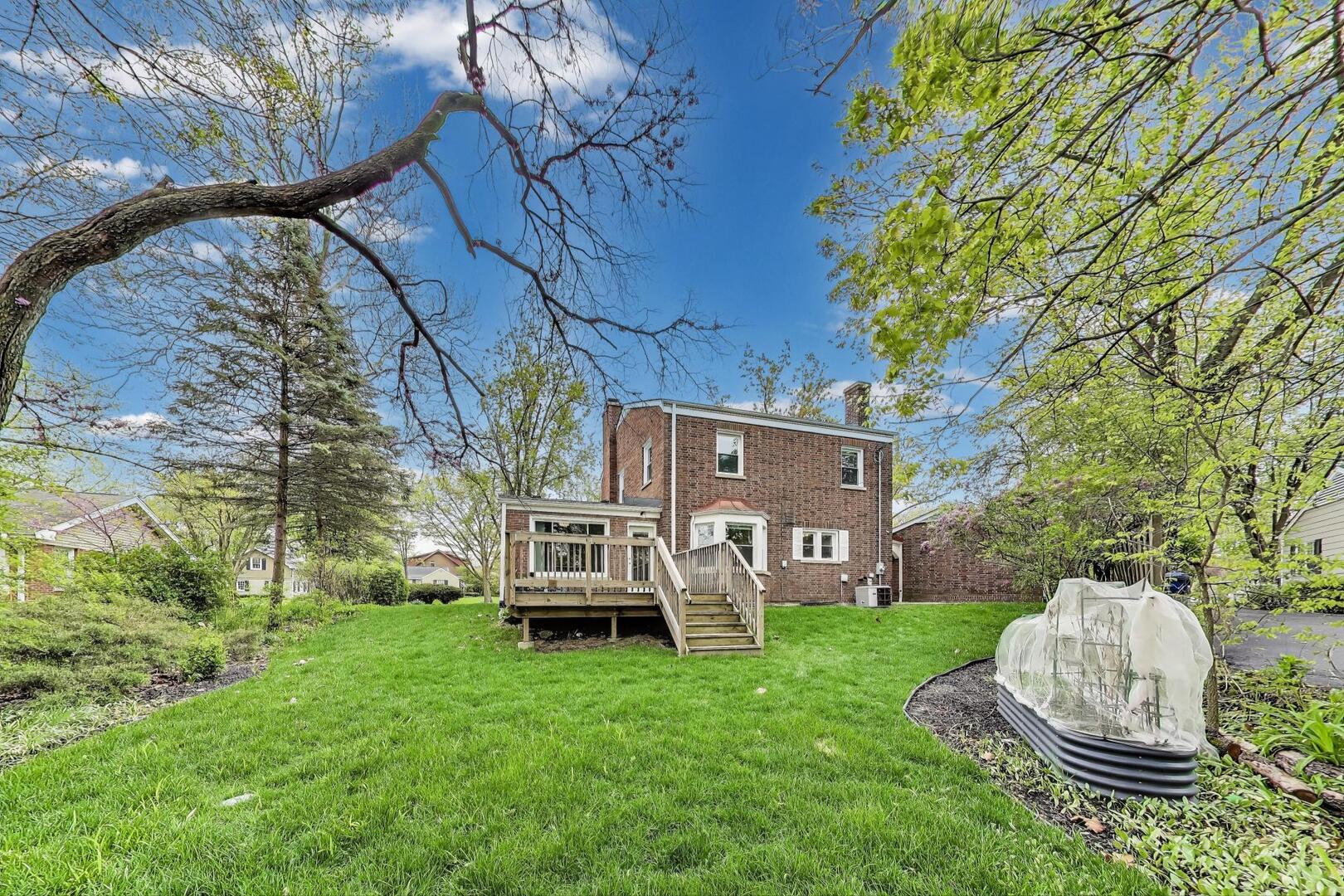 2515 Gordon Drive Flossmoor, IL 60422 - Photo 37 of 42 a view of a chair and table in back yard of the house
