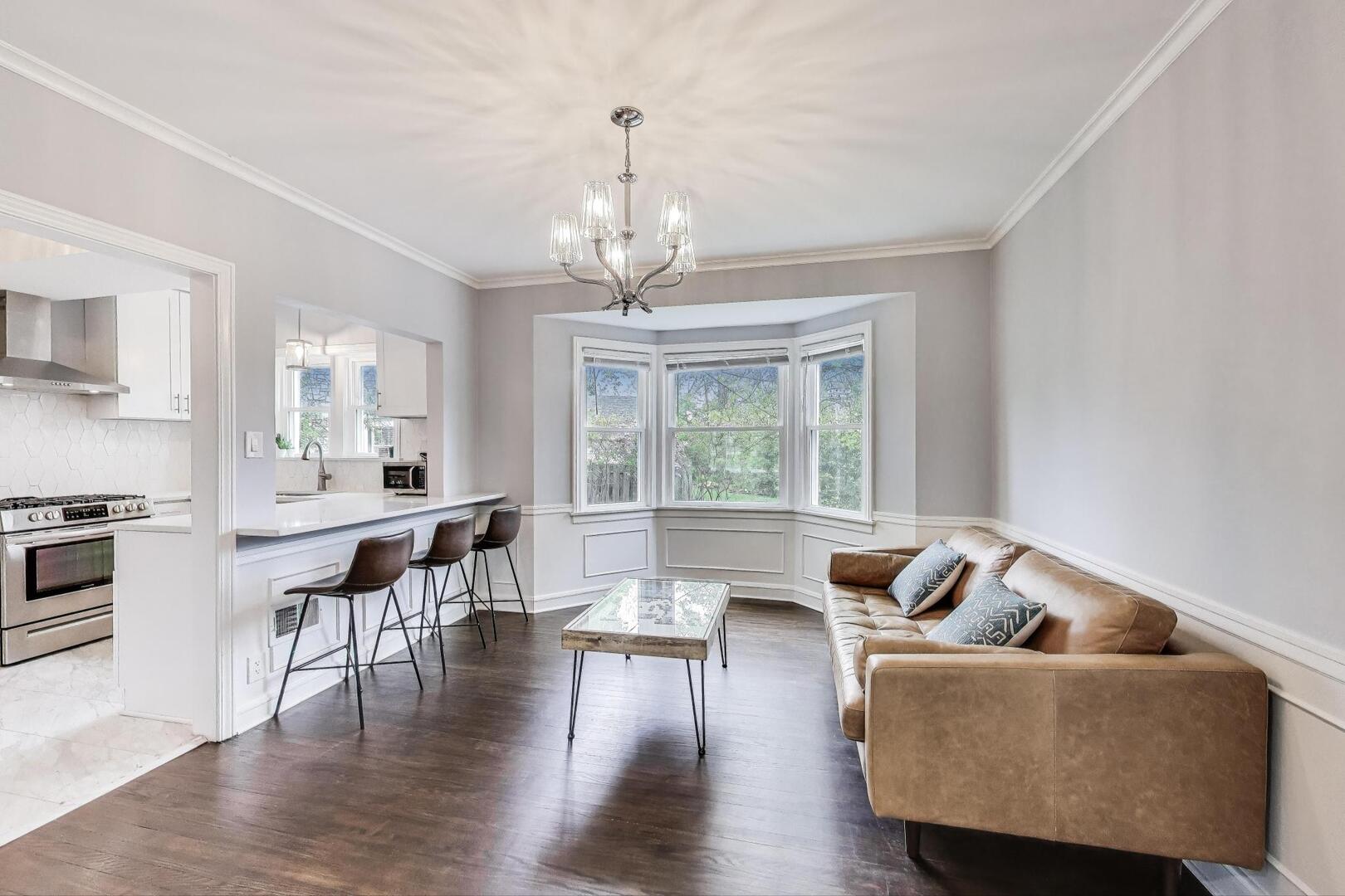 2515 Gordon Drive Flossmoor, IL 60422 - Photo 8 of 42 a living room with furniture wooden floor and a chandelier