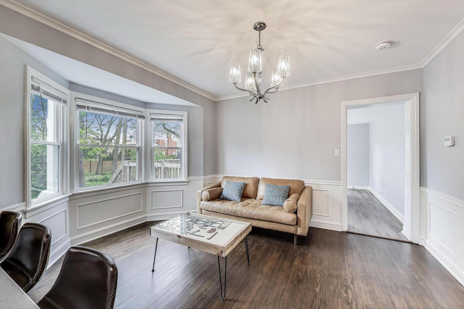 2515 Gordon Drive Flossmoor, IL 60422 - Photo 9 of 42 a living room with furniture and a chandelier
