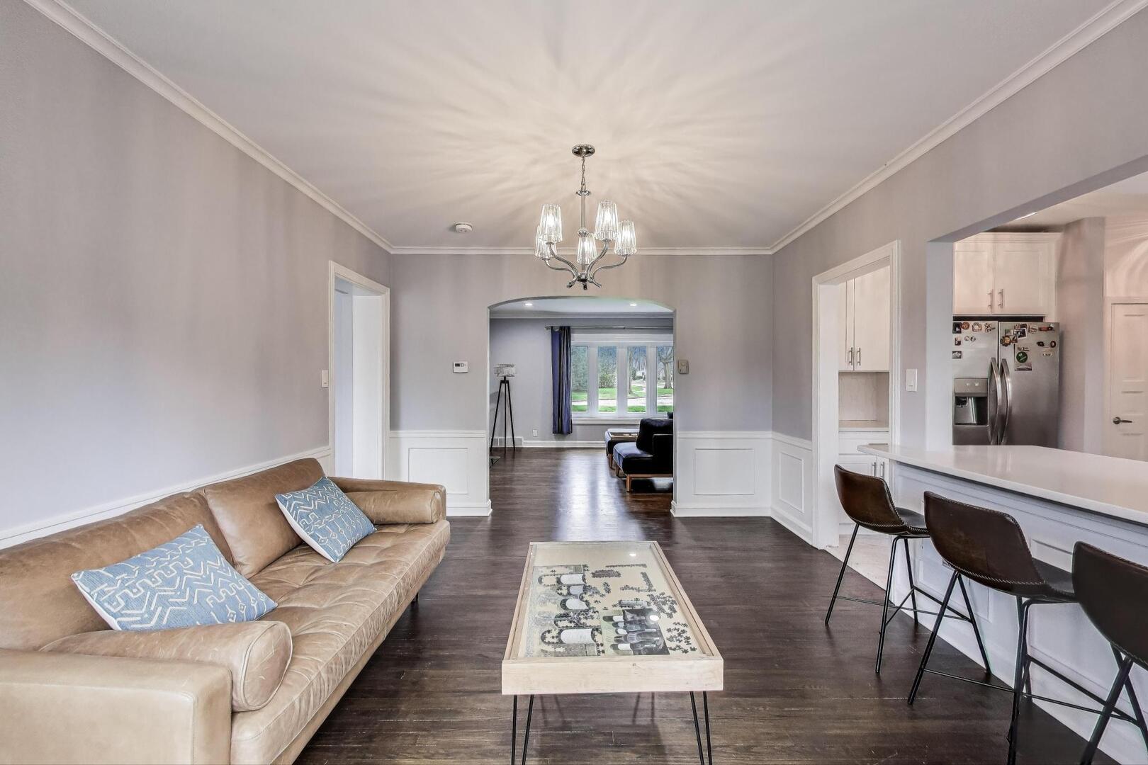 2515 Gordon Drive Flossmoor, IL 60422 - Photo 10 of 42 a living room with furniture and a chandelier
