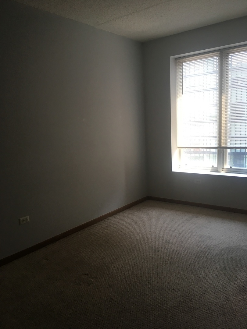 515 Main Street, Unit 608 Evanston, IL 60202 - Photo 20 of 21 a view of an empty room with a window