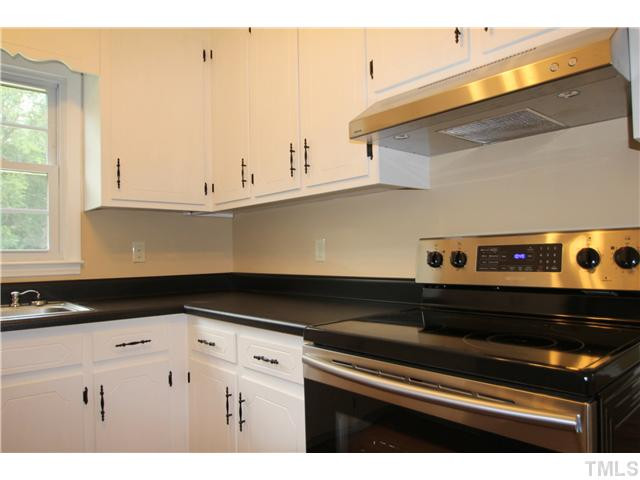 Completely updated kitchen with new stainless steel appliances, counter top and laminate flooring Kitchen