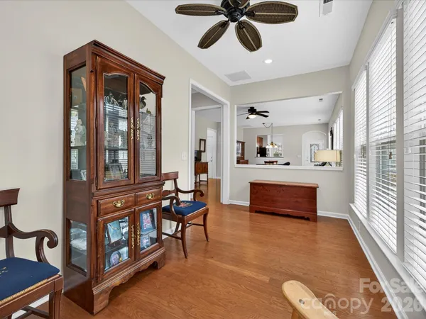 a view of kitchen with furniture and a chandelier