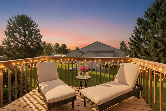 a view of a chairs and table in patio