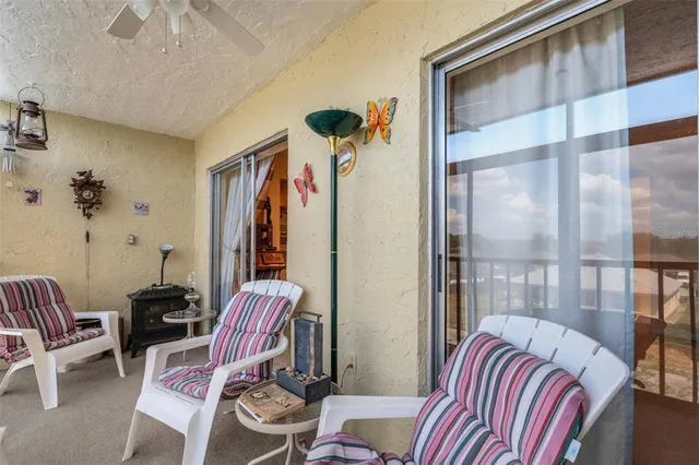 a view of a bedroom with furniture and windows