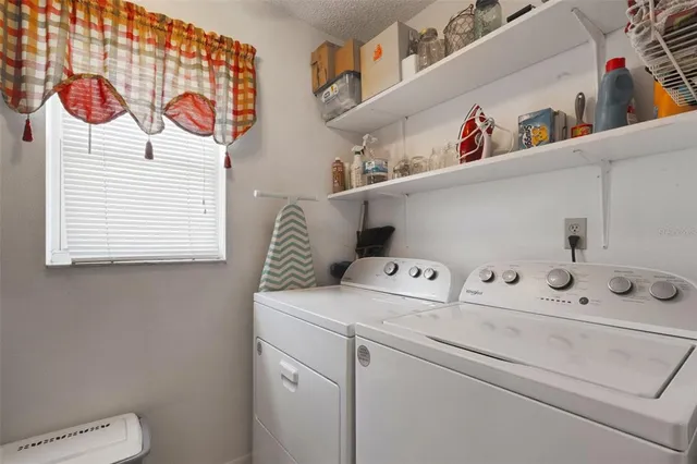 a utility room with dryer and washer