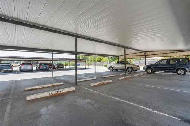 a view of parking with cars parked