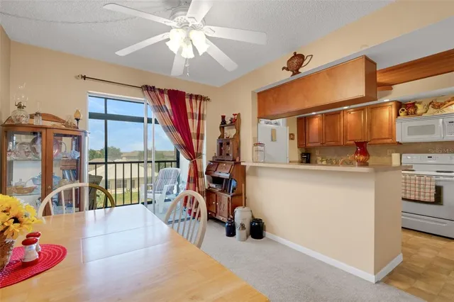 a view of living room with furniture and a chandelier