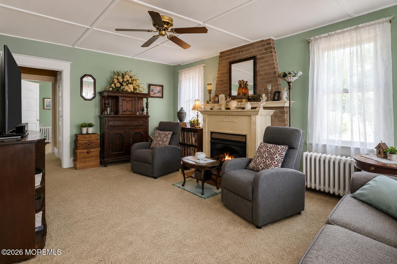 24 Foster Street Middletown, NJ 07701 - Photo 8 of 23 a living room with furniture and a fireplace