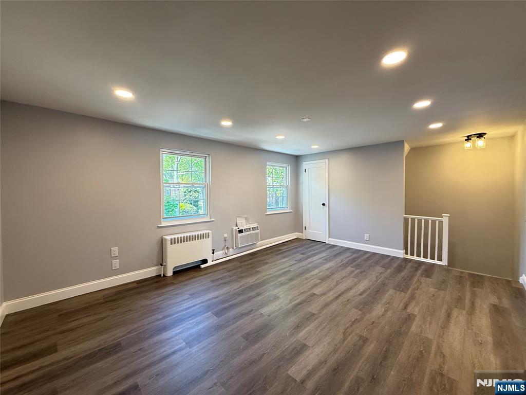 20 Clark Court Rutherford, NJ 07070 - Photo 9 of 29 an empty room with wooden floor and windows