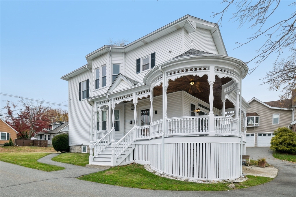 2396 Riverside Avenue Somerset, MA 02726 - Photo 11 of 42 a front view of a house with a garden