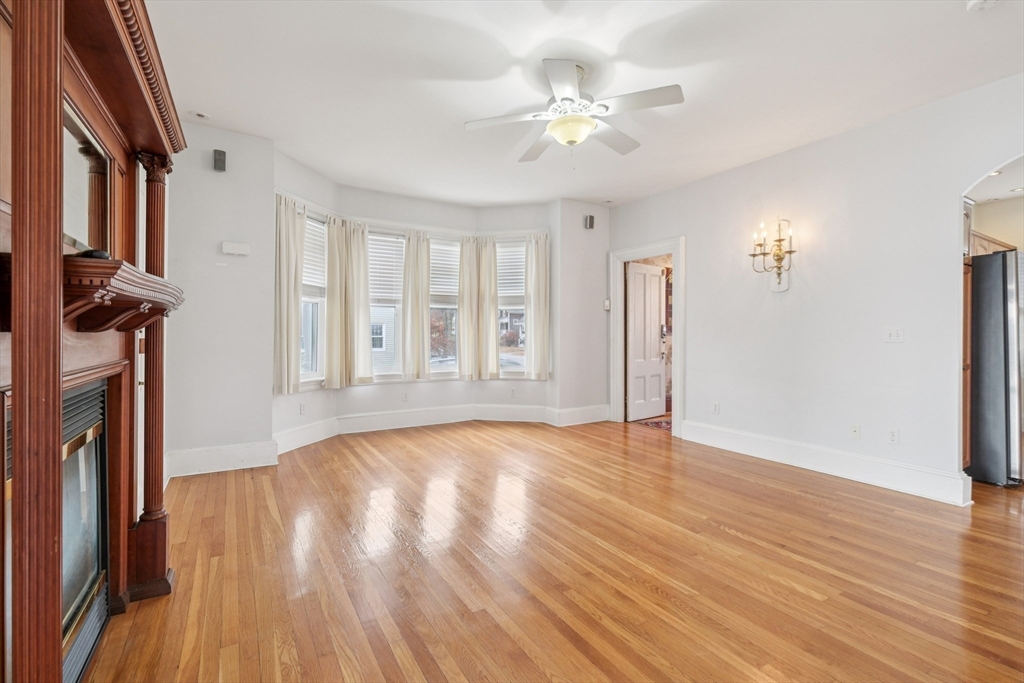 2396 Riverside Avenue Somerset, MA 02726 - Photo 19 of 42 a view of an empty room with wooden floor and a window