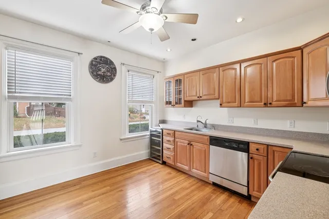 a kitchen with stainless steel appliances granite countertop a stove and a sink