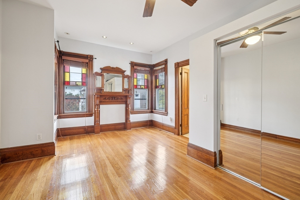 2396 Riverside Avenue Somerset, MA 02726 - Photo 24 of 42 a view of a big room with wooden floor and windows