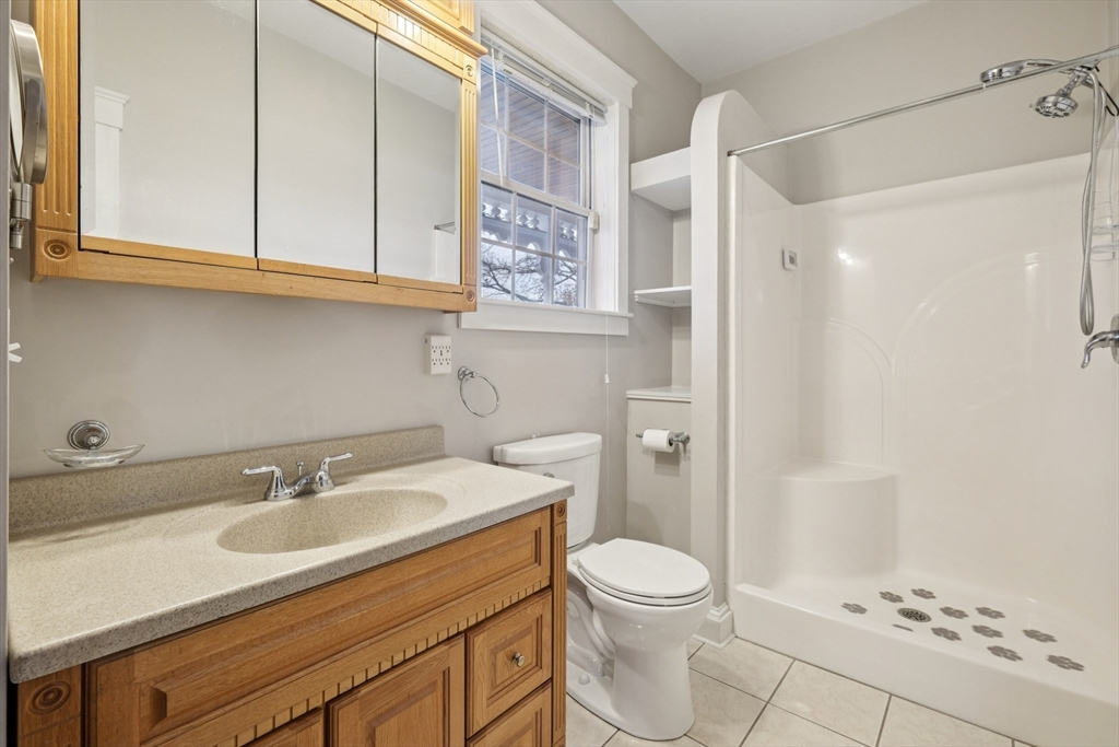2396 Riverside Avenue Somerset, MA 02726 - Photo 26 of 42 a bathroom with a sink a toilet and shower