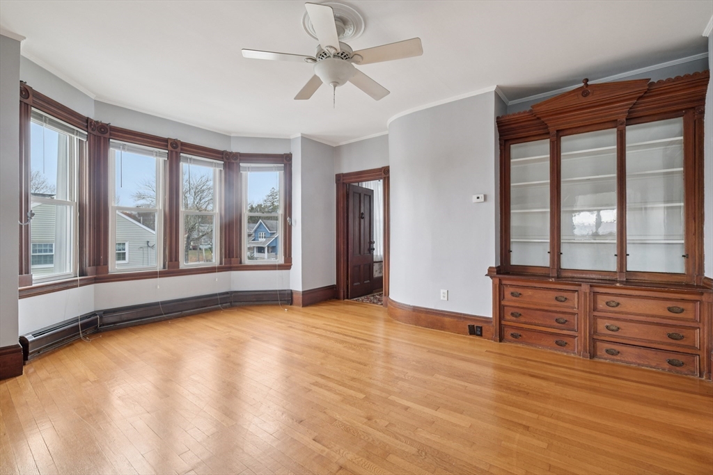 2396 Riverside Avenue Somerset, MA 02726 - Photo 34 of 42 a view of an empty room with a window and wooden floor