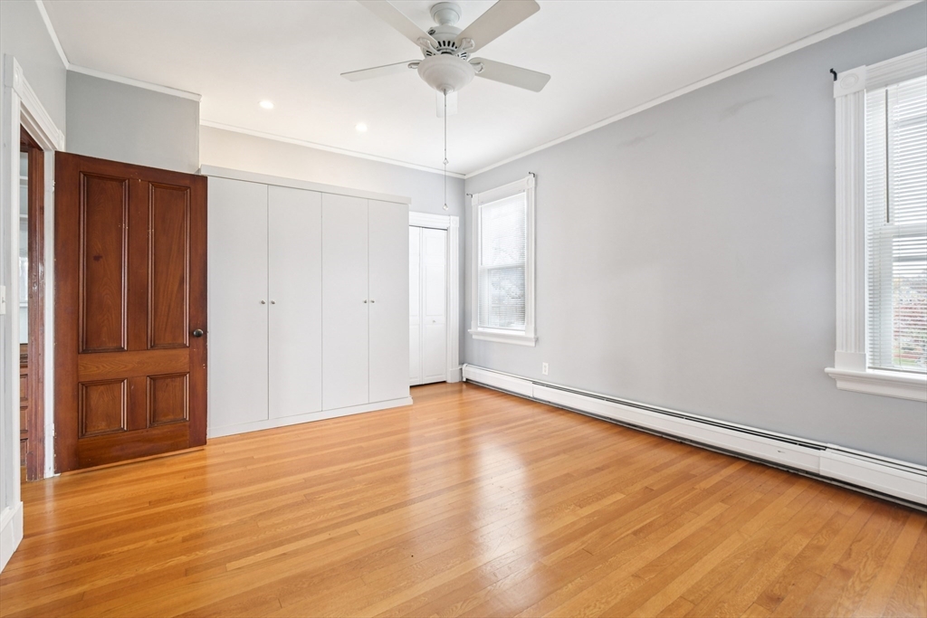 2396 Riverside Avenue Somerset, MA 02726 - Photo 39 of 42 wooden floor in an empty room with a window