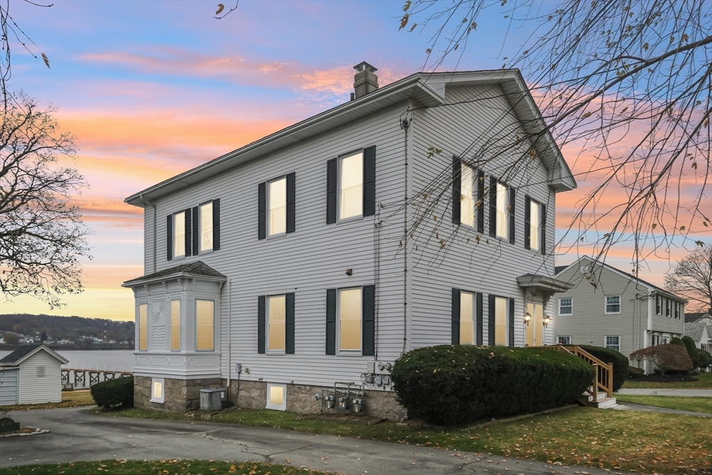 2396 Riverside Avenue Somerset, MA 02726 - Photo 41 of 42 a front view of residential houses with yard