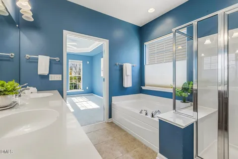 a bathroom with a tub and shower