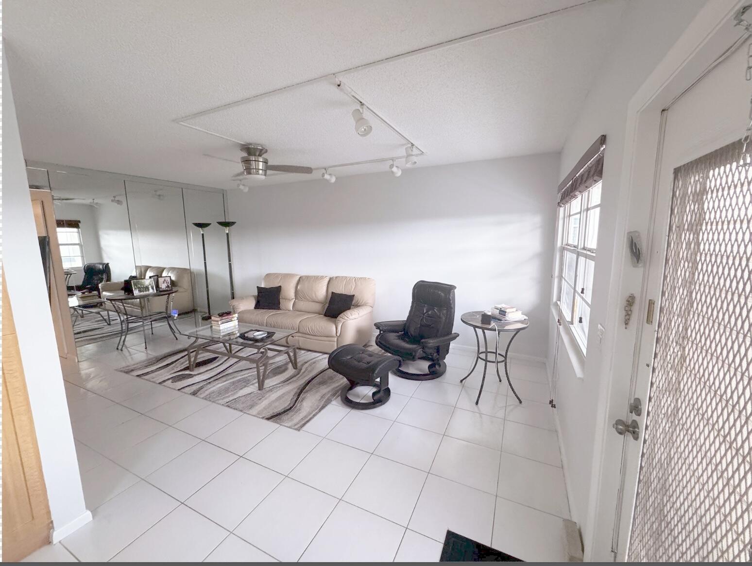 a kitchen with stainless steel appliances kitchen island granite countertop a sink and cabinets