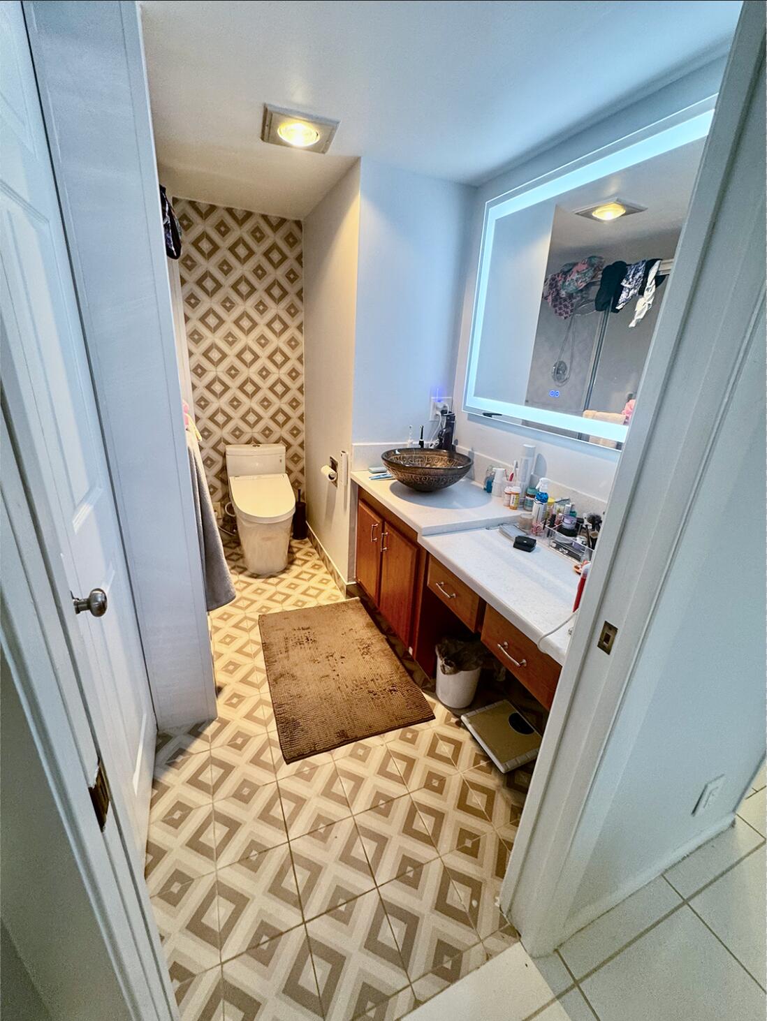 4063 Yarmouth C Boca Raton, FL 33434 - Photo 5 of 27 a bathroom with a sink and a mirror