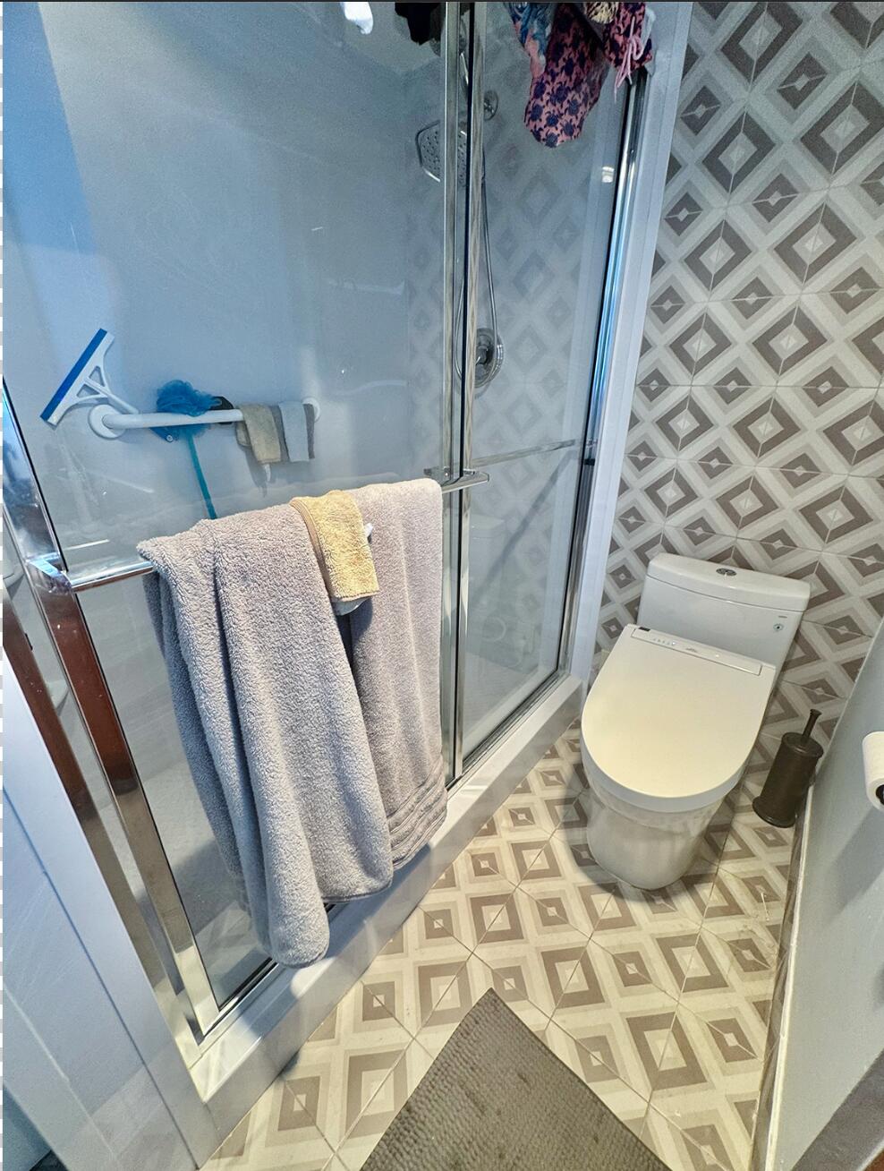 4063 Yarmouth C Boca Raton, FL 33434 - Photo 6 of 27 a bathroom with a toilet and a shower