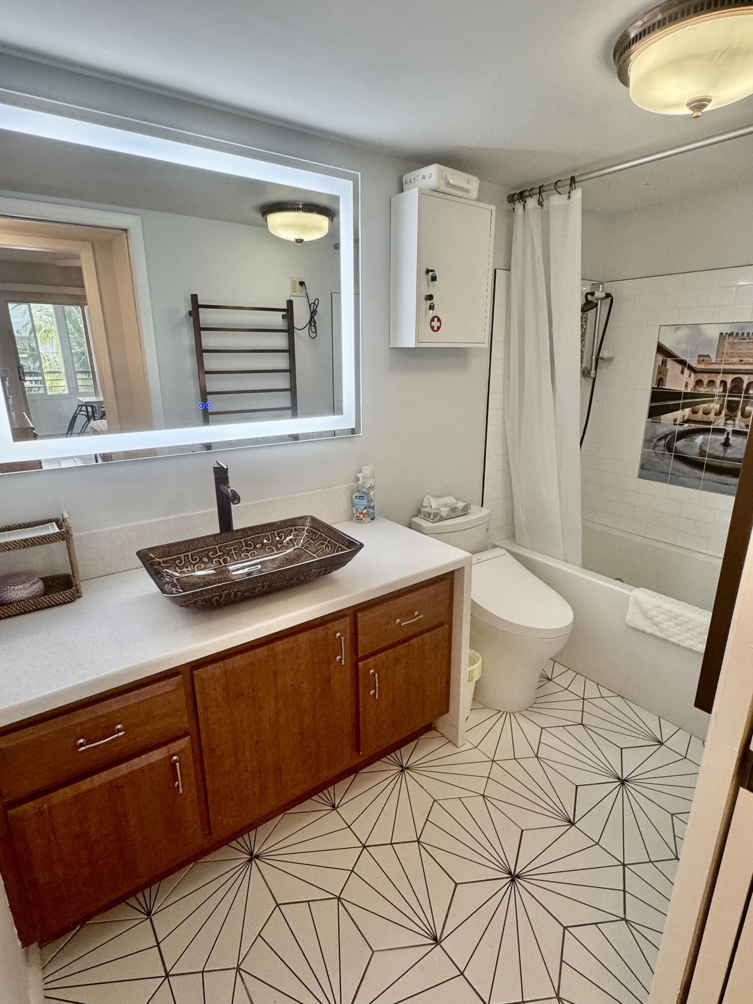 4063 Yarmouth C Boca Raton, FL 33434 - Photo 8 of 27 a bathroom with a granite countertop sink toilet and shower