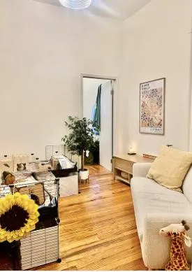 a living room with furniture and flowers
