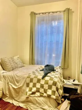 a bedroom with a bed and a mirror