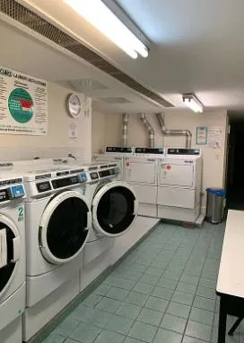 a utility room with sink dryer and washer