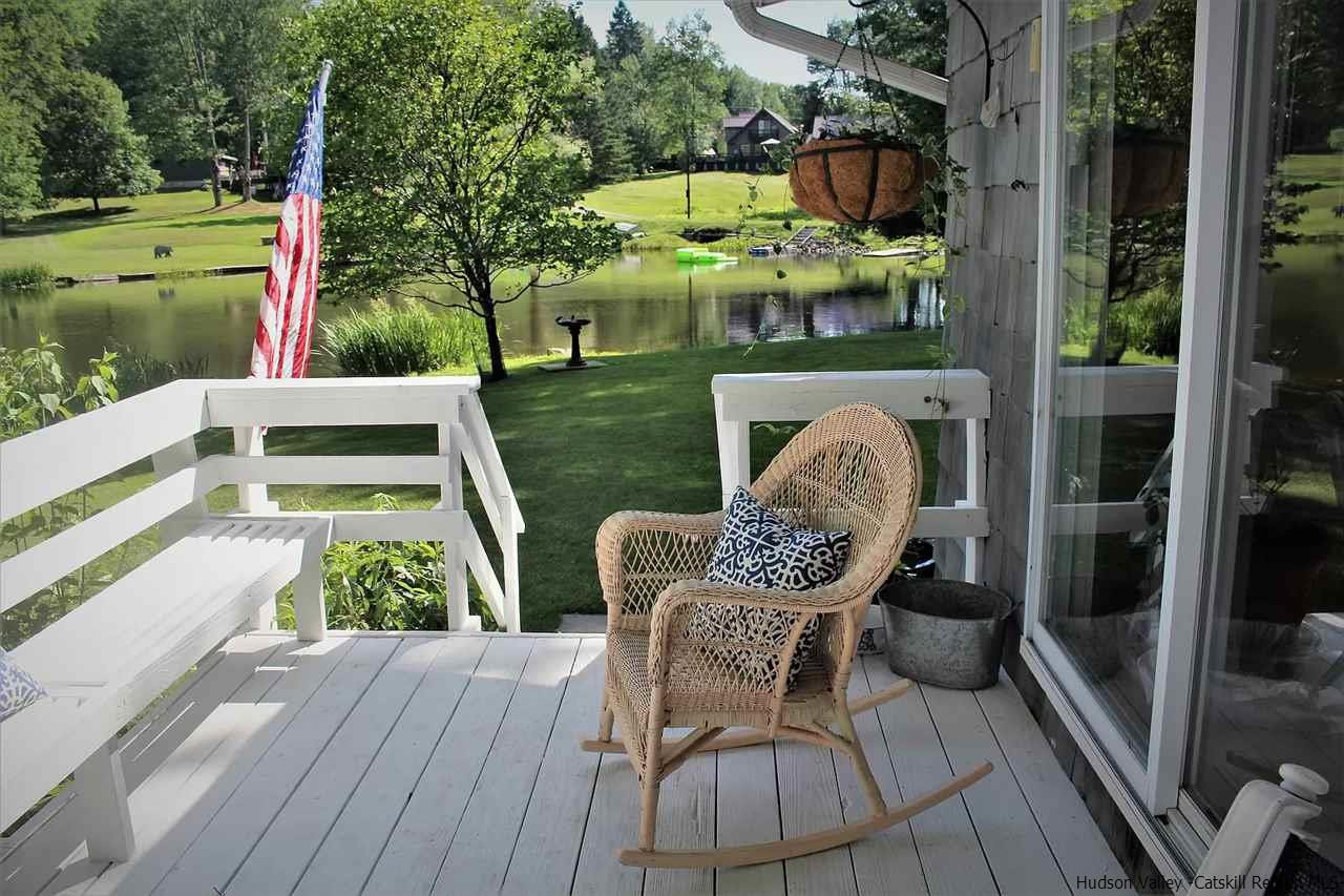379 Tanglewood Lane Road Delhi, NY 13752 - Photo 32 of 35 a view of a chair and tables in the balcony