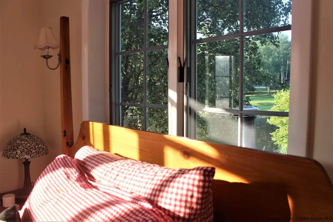 379 Tanglewood Lane Road Delhi, NY 13752 - Photo 5 of 35 a bedroom with a bed and a view of balcony