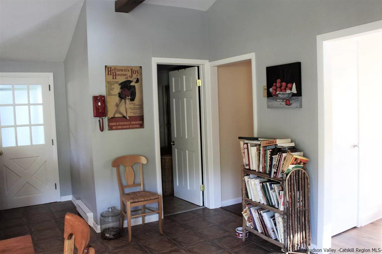 379 Tanglewood Lane Road Delhi, NY 13752 - Photo 6 of 35 a view of a workspace with furniture and a window
