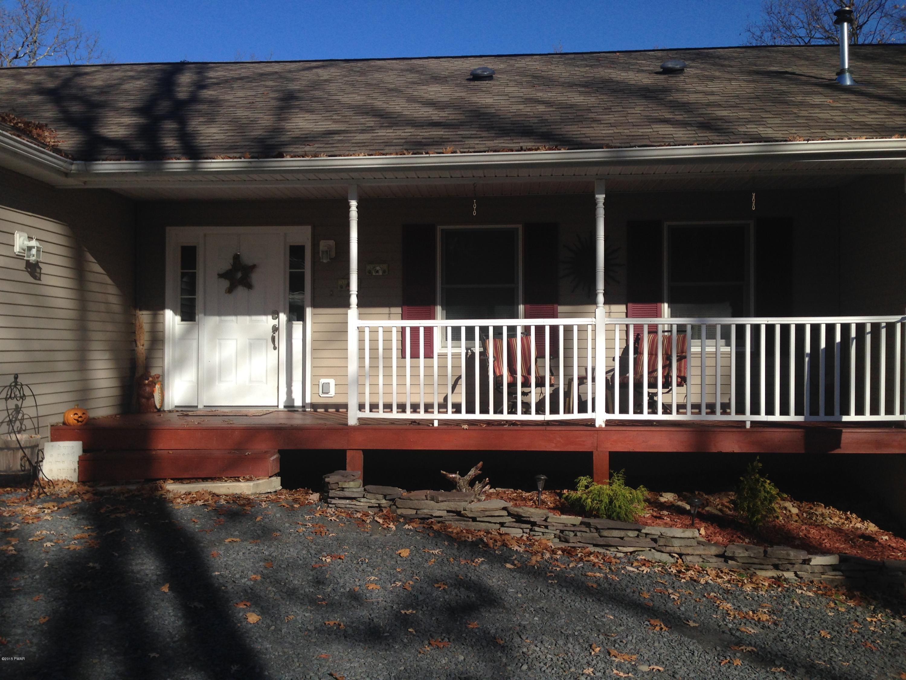 141 Weasel Road Dingmans Ferry, PA 18328 - Photo 3 of 28 a view of a house with a yard