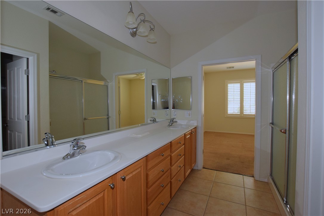 2452 Cosmic Ray Place Henderson, NV 89044 - Photo 30 of 51 double sinks in primary bath and step in shower