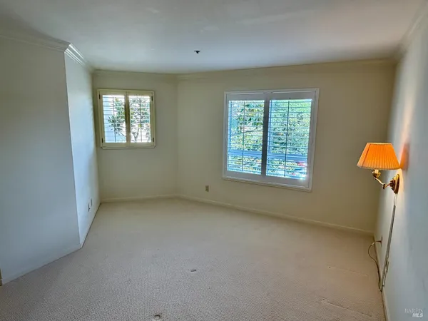a bathroom with a sink mirror and toilet