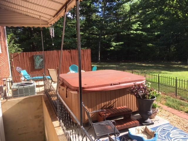 549 Blue Ridge Drive Blue Ridge, VA 24064 - Photo 18 of 22 a view of a patio with a table chairs and a garden