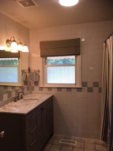 549 Blue Ridge Drive Blue Ridge, VA 24064 - Photo 10 of 22 a bathroom with a sink vanity granite and a mirror