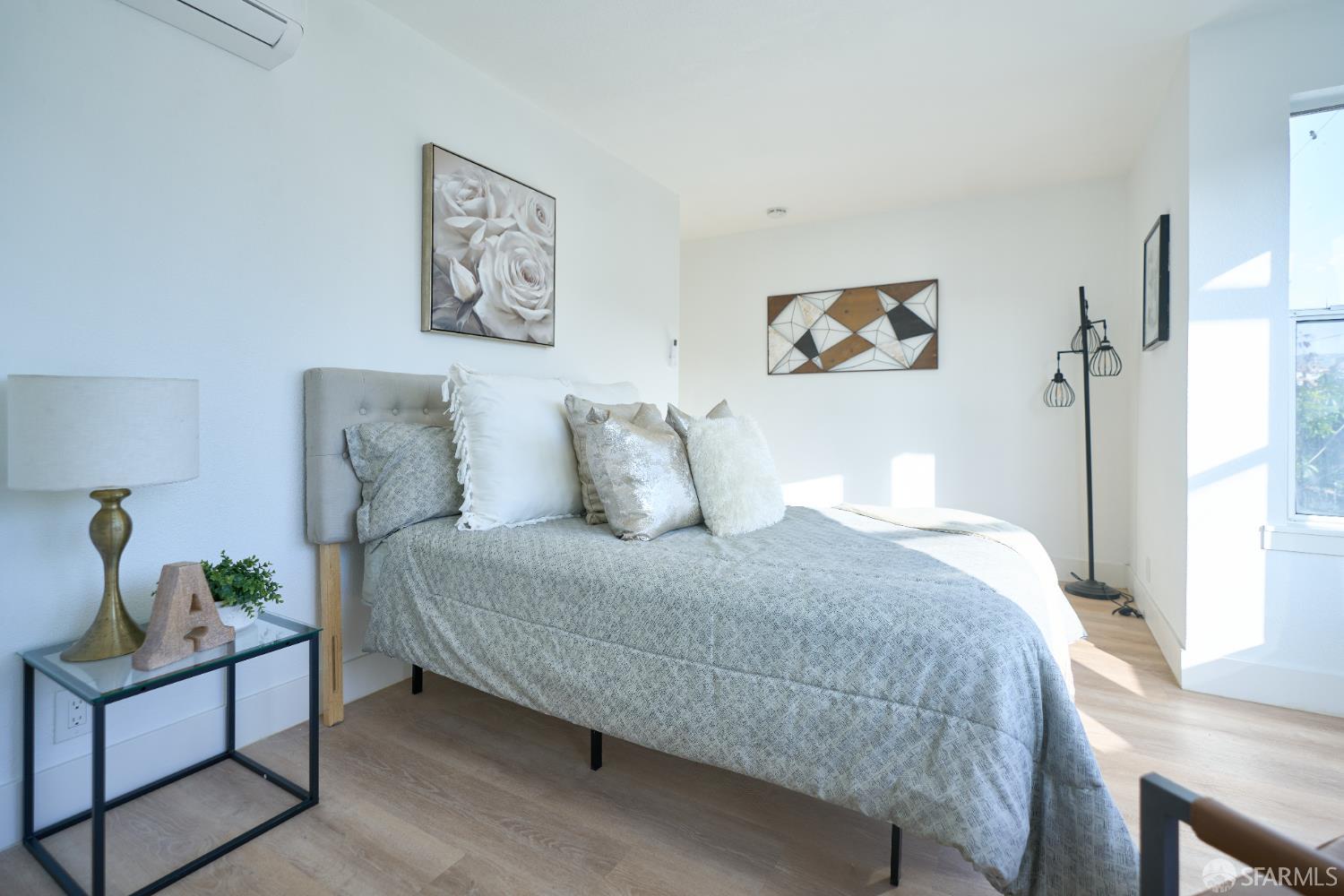 1270 South Van Ness Avenue, Unit A San Francisco, CA 94110 - Photo 14 of 28 a bedroom with a bed and a window