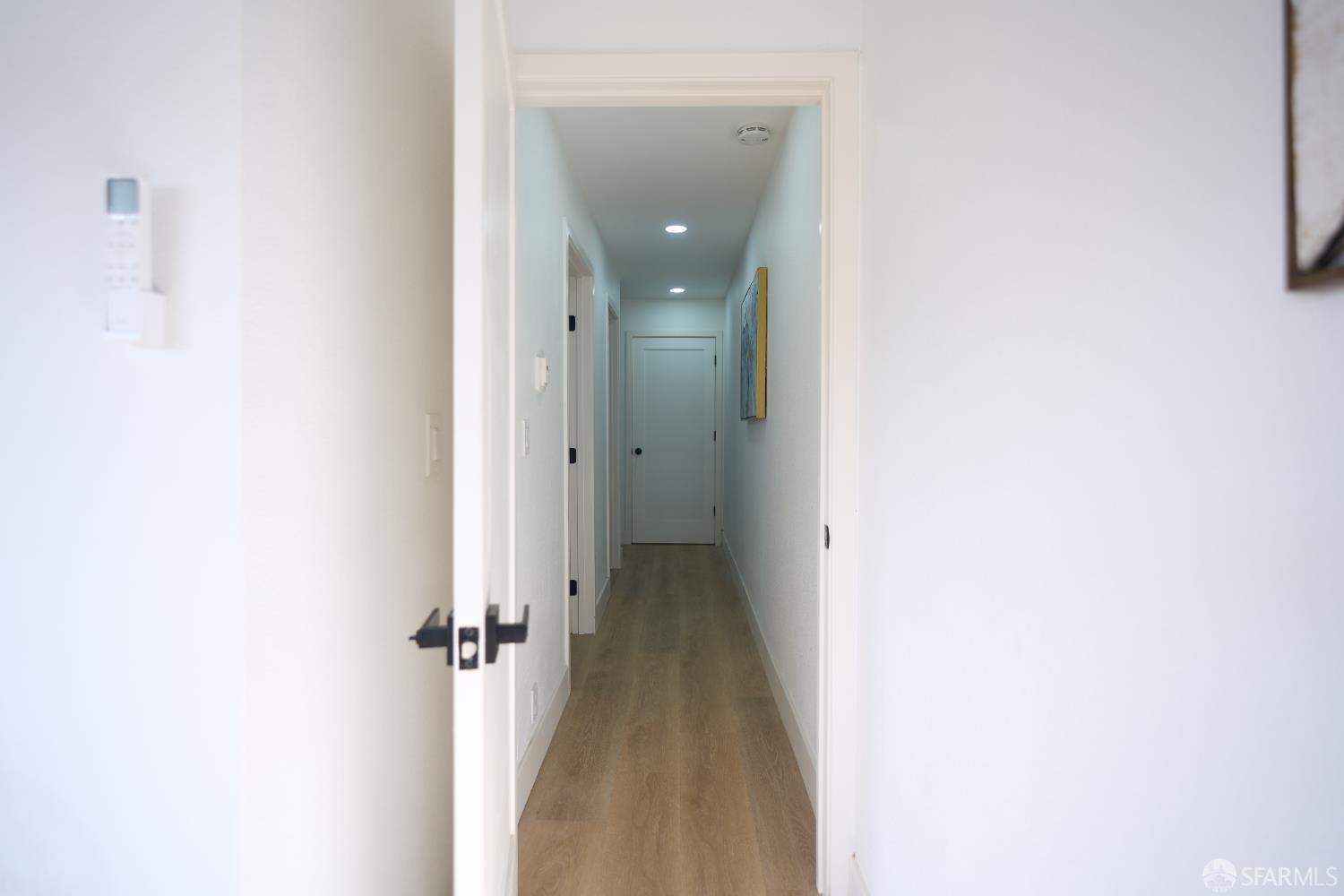 1270 South Van Ness Avenue, Unit A San Francisco, CA 94110 - Photo 16 of 28 a view of a hallway with wooden floor