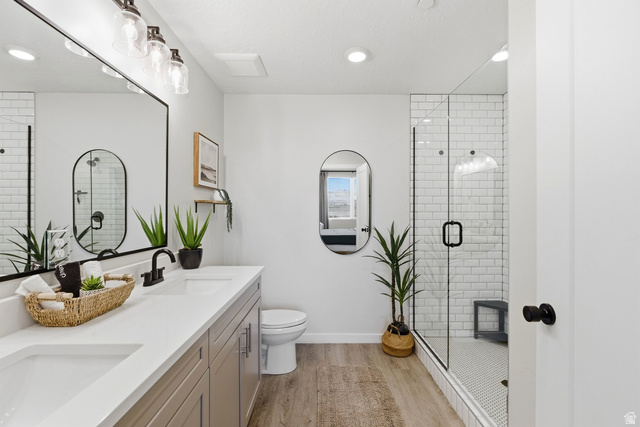 961 West Akoya Pearl Road, Unit 300 St. George, UT 84790 - Photo 25 of 60 Full bathroom with double vanity, a stall shower, light wood-style floors, and recessed lighting