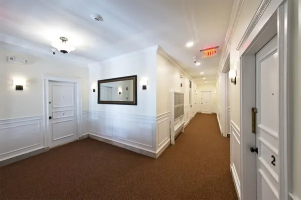 a view of a hallway with closet