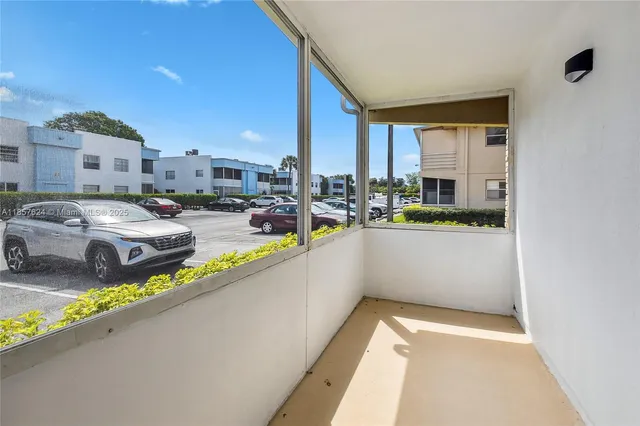 a view of swimming pool with outdoor seating