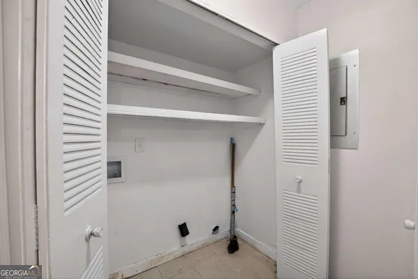 a bathroom with a shower and a window