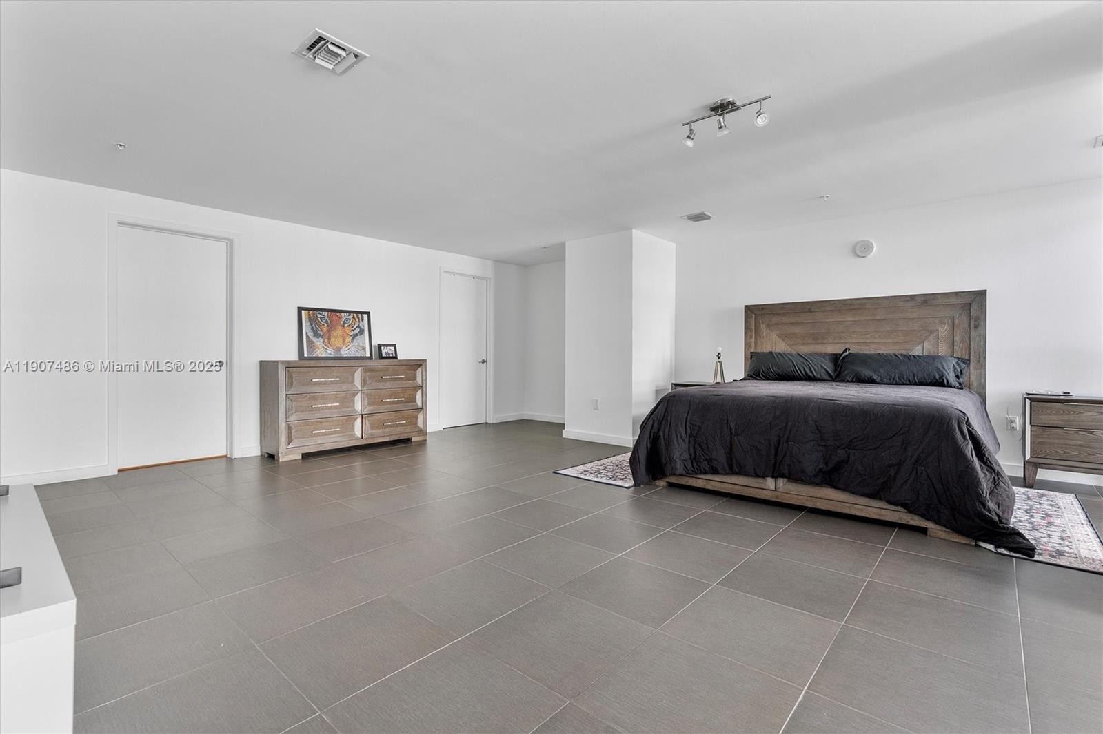 3301 Northeast 1st Avenue, Unit M0502 Miami, FL 33137 - Photo 13 of 29 a bedroom with a bed and window