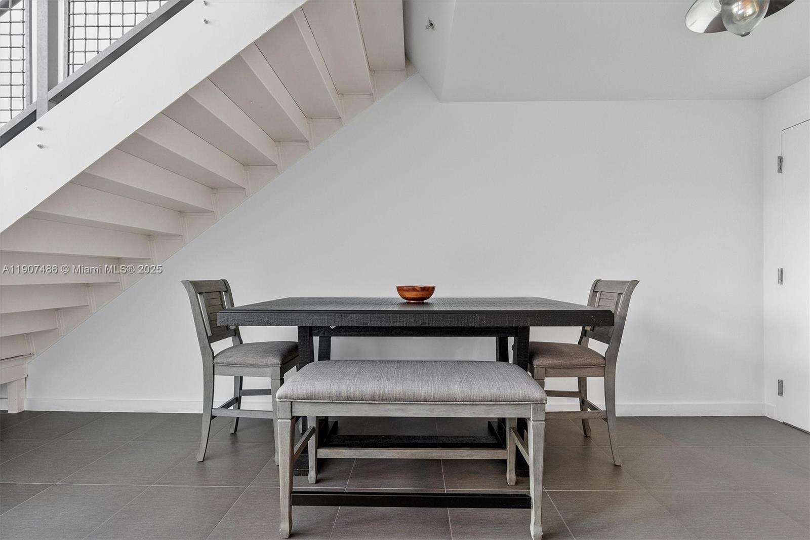 3301 Northeast 1st Avenue, Unit M0502 Miami, FL 33137 - Photo 6 of 29 a view of a dining room with furniture and wooden floor