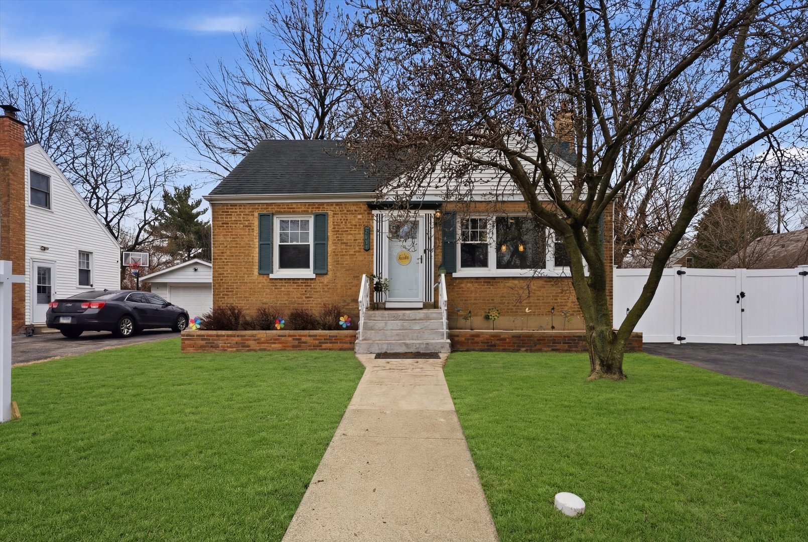 3719 211th Place Matteson, IL 60443 - Photo 1 of 48 a front view of a house with garden